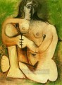 Femme nue accroupie sur fond vert 1960 Cubismo